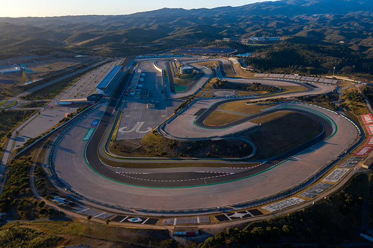 Portimao, Portugal - May 2021 - Aerial drone view over racing track Algarve International Circuit in Lagos Portimao. Sunset landscape.